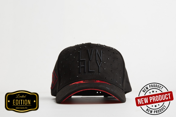 Black cap with red interior and 'LVN HLY' branding on a white background